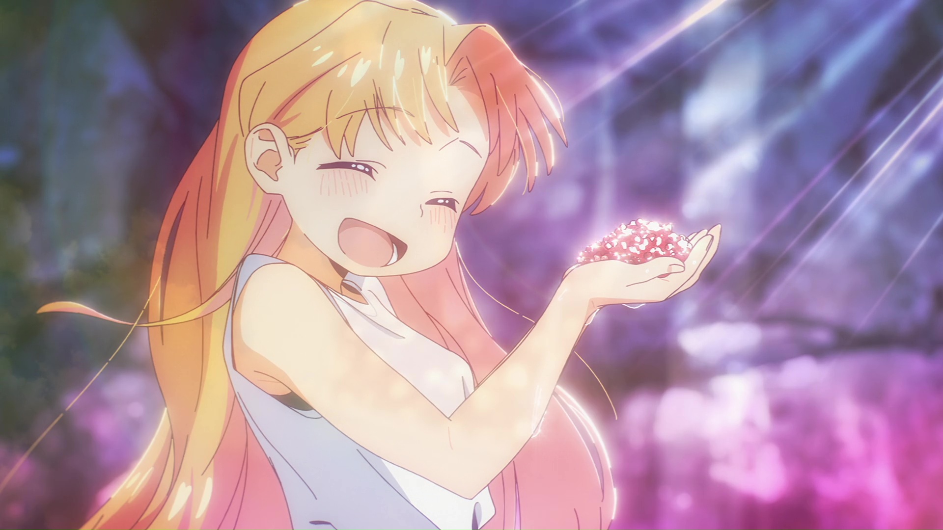 image of Ruri holding a handful of stones, smiling wide with closed eyes