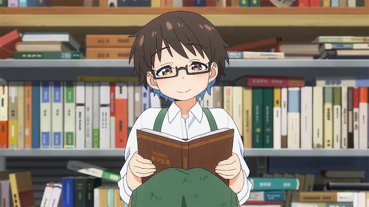 Image of Youko smiling behind a book